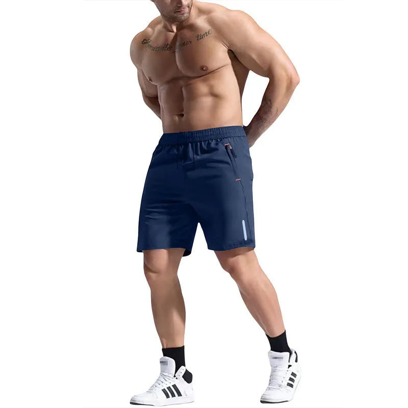 Men's grey elastic waist sports shorts made from polyester and bamboo fibre fabric on a man running outdoors.