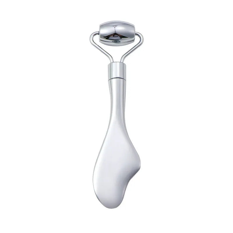 Stainless steel facial massage set showing a double-ended acupuncture pen with pointed tip and heart roller, plus a gua sha scraping plate.