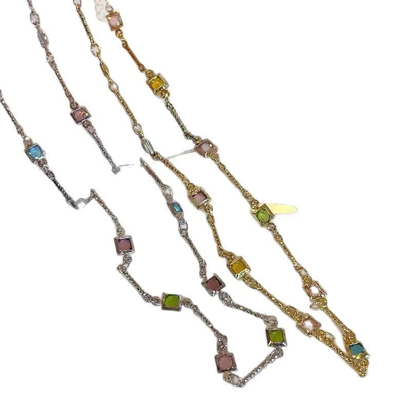 Gold alloy geometric necklace with a square colour artificial crystal pendant on a clavicle-length chain.
