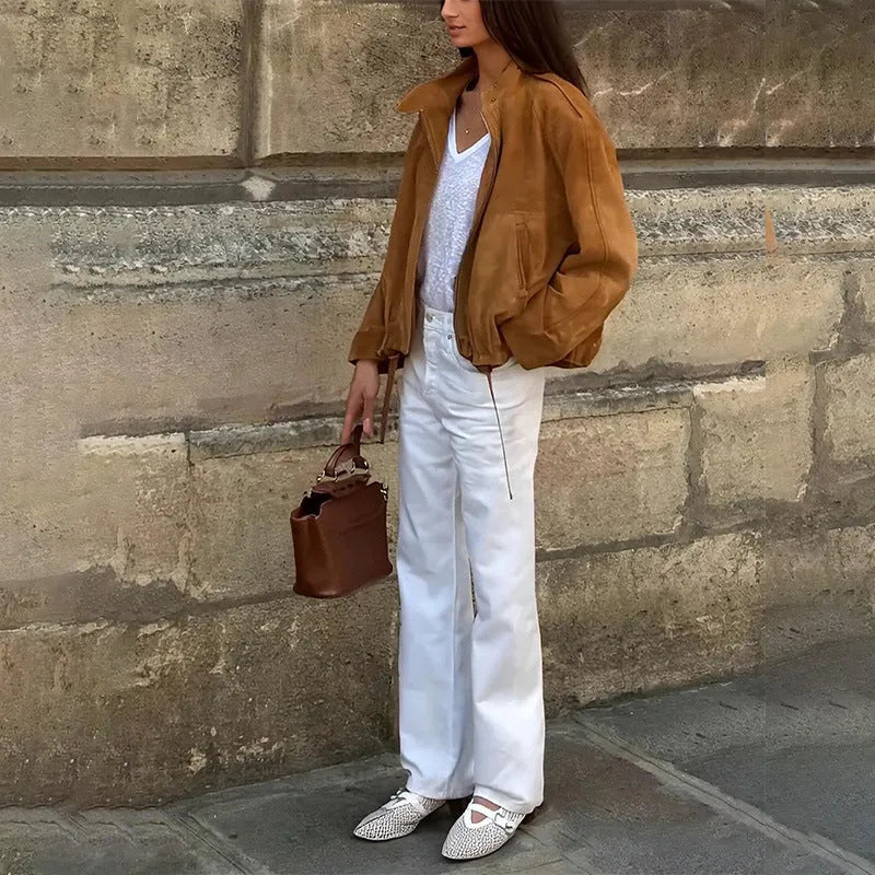 Solid colour loose-fit polyester jacket with long sleeves on a hanger