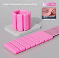 Velcro silicone fitness bracelet with detachable weight in black, blue, gray, or pink.