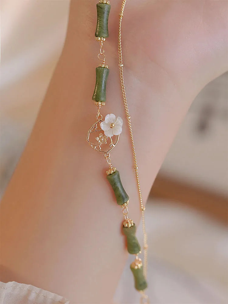 Natural green Olivine double layer bracelet with Twin Bells of Ireland and Olive Branch charms.