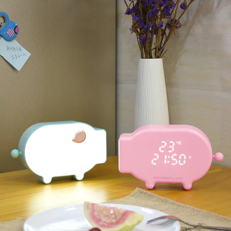 Blue digital LED alarm clock showing time and temperature on display with USB cable