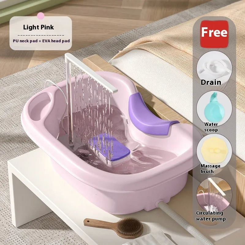 Portable plastic shampoo basin with head pad, circulating pump and massage brush for bed use.