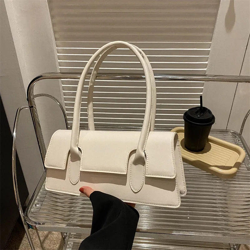 Women's small square shoulder bag in PU leather with stitching detail, shown in yellow colour