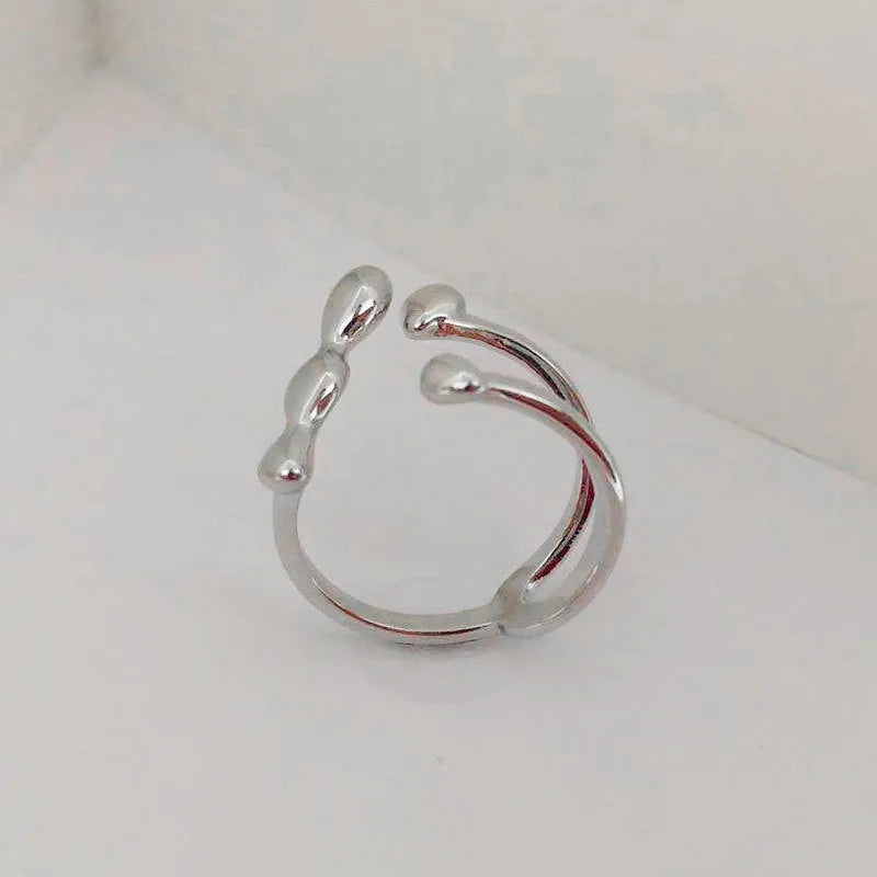 Brass adjustable opening ring with circular design in gold or silver finish for women