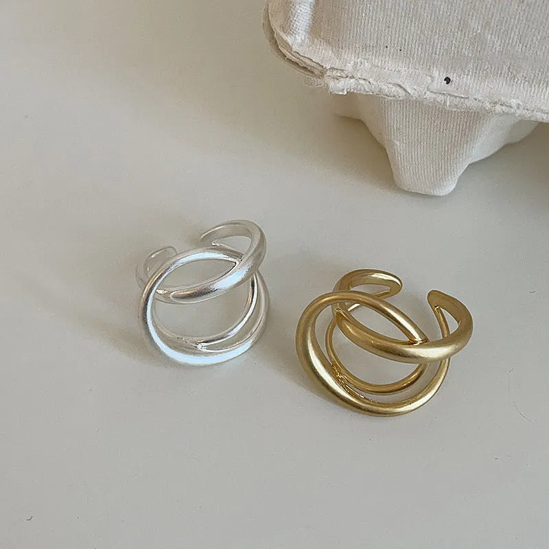 Three-dimensional interlaced geometric open ring with matte metal finish