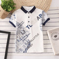 Boys' short sleeve cotton shirt in a solid colour with a lapel collar, shown on a hanger.