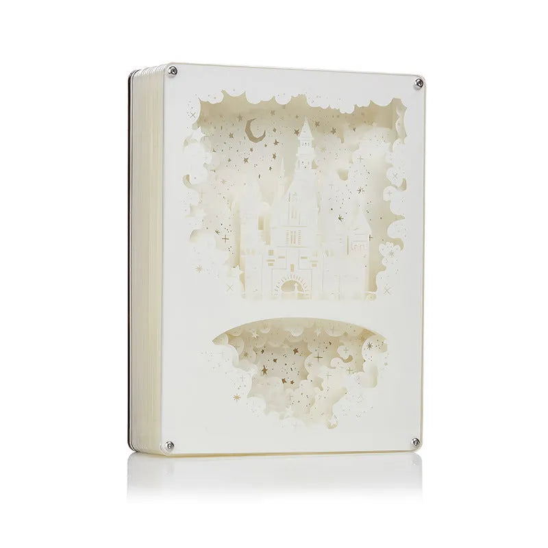 Modern 3D carved USB night light with remote control on a bedside table.