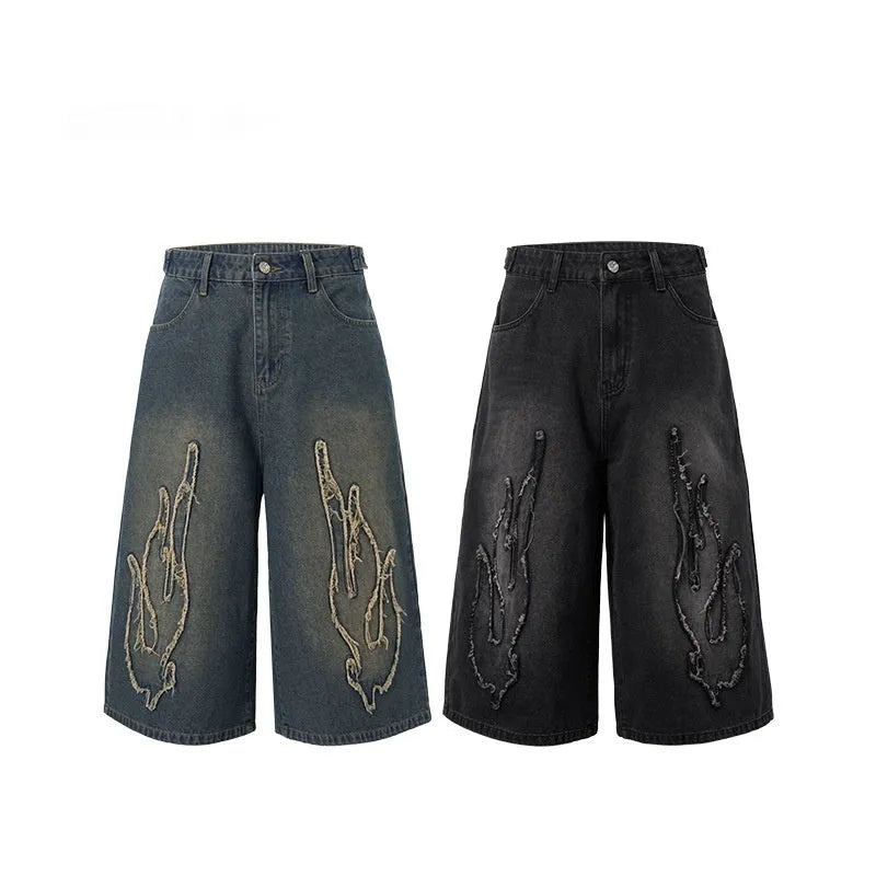 Men's black denim shorts with flame embroidery patch decoration and straight cut cropped design