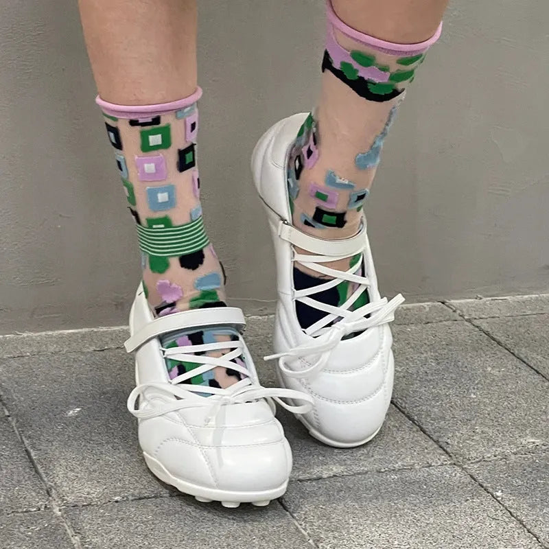 Women's silver lace-up bow sports shoes with round toe and low-top design on a white background.