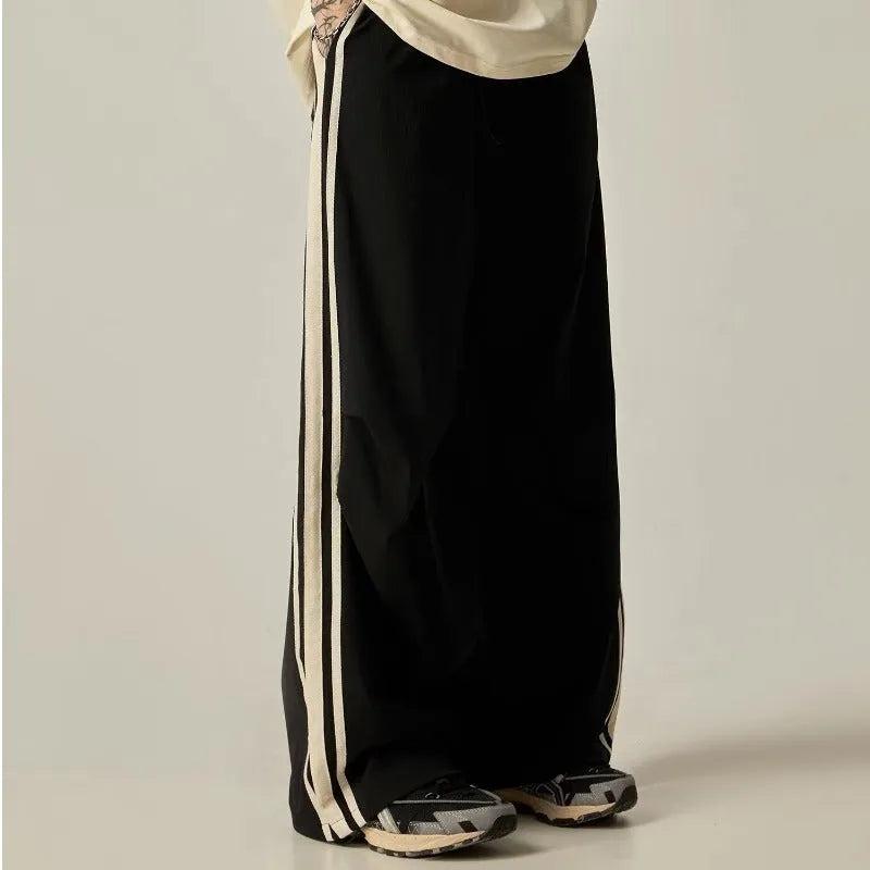 Men's black wide leg climbing trousers with high waist and straight leg design on mannequin