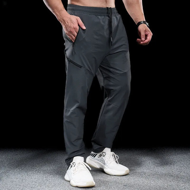 Men's waterproof quick-drying nylon workout pants in Army Green colour, showing mid waist design and trousers length