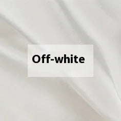 Solid colour silk duvet cover shown in Lotus Pink, laid flat on a bed.