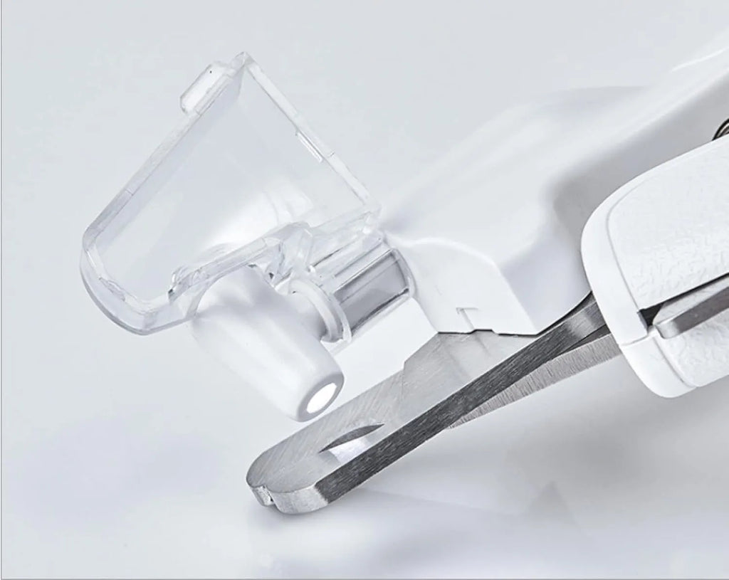 White pet nail clippers with LED light, anti-splash guard, and leather-like handle.