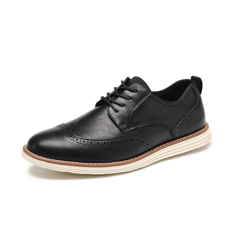 Men's black slip-on business casual shoes with decorative carving on the PU leather upper