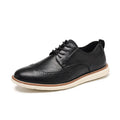 Men's black slip-on business casual shoes with decorative carving on the PU leather upper