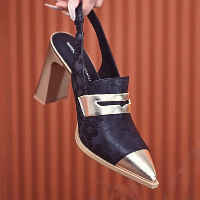 Black women's high-heel sandals with a chunky heel, pointed toe, and a single elasticated ankle strap.
