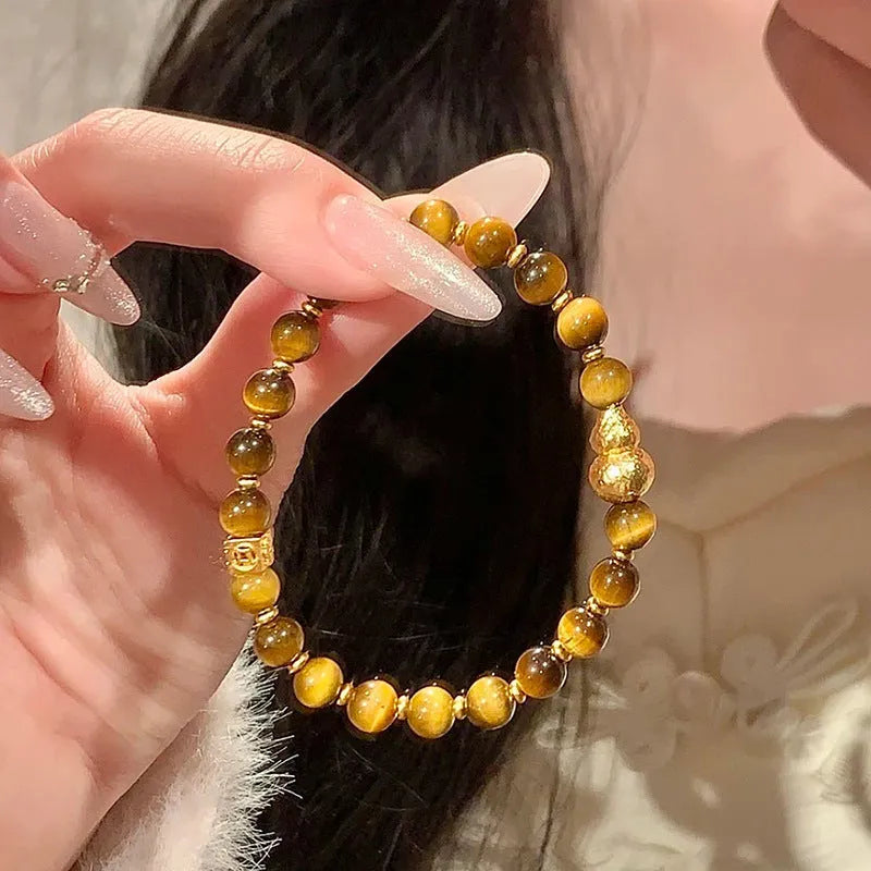Natural yellow Tiger's Eye stone bracelet with Hetian jade accents in simple design