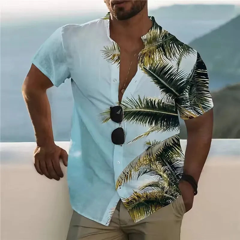 Man wearing a loose-fitting short sleeve shirt with a colourful floral pattern, cardigan style.