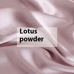 Solid colour silk duvet cover shown in Lotus Pink, laid flat on a bed.