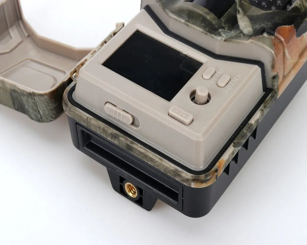 Outdoor Bluetooth hunting trail camera with camouflage finish and infrared LEDs for night vision.