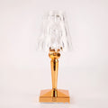 Rose gold portable touch projection night light on a surface showing its acrylic construction and compact size