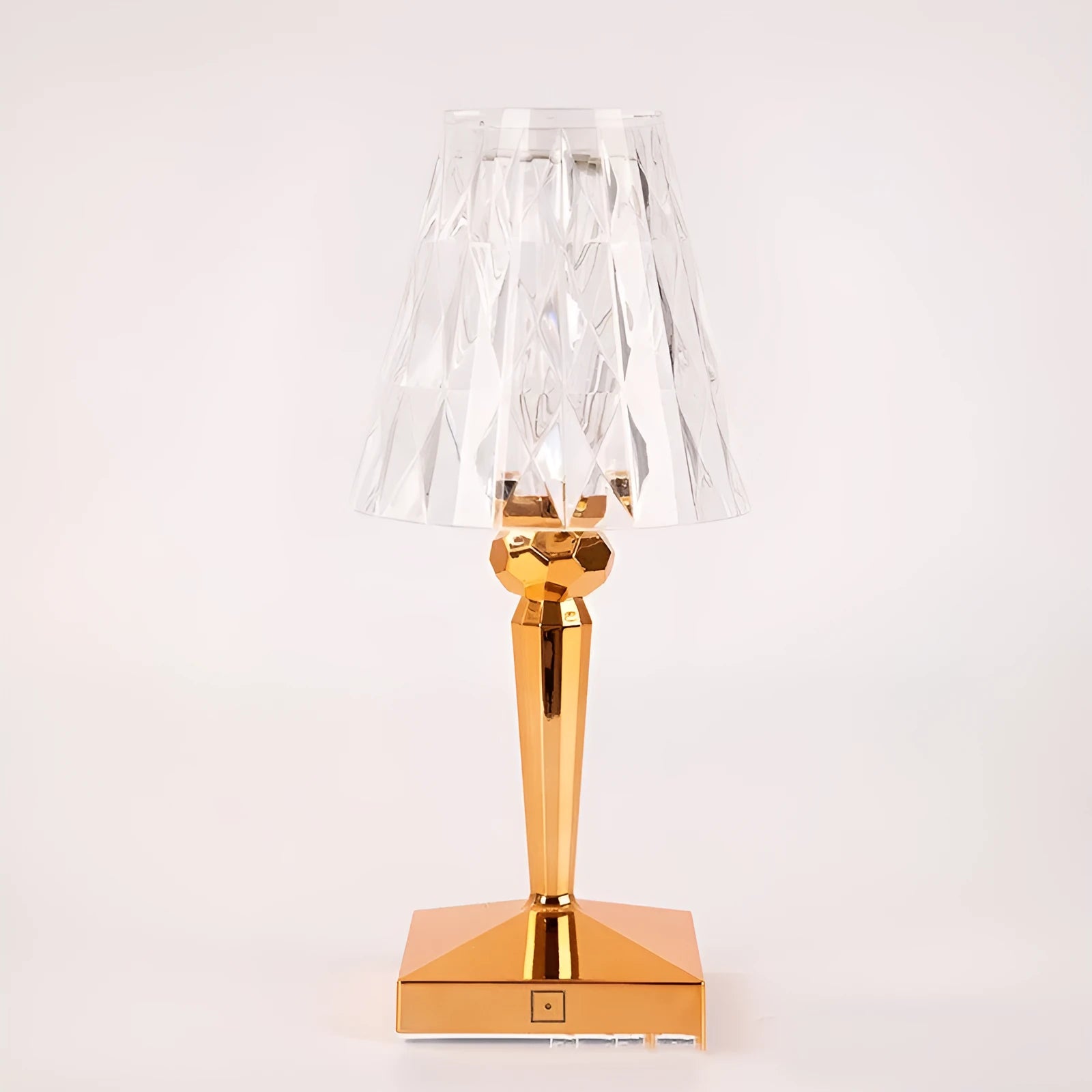 Rose gold portable touch projection night light on a surface showing its acrylic construction and compact size