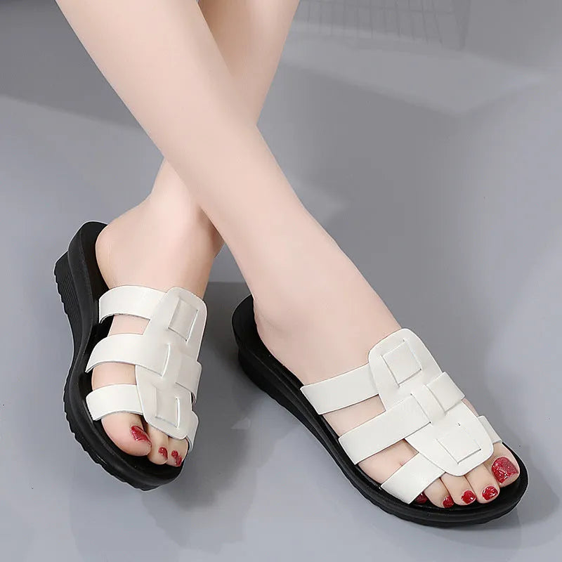 Women's flat bottom slippers with waxed leather upper in beige, black, and brown colours