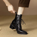 Women's black pointed-toe ankle boots with block heel and short shaft design