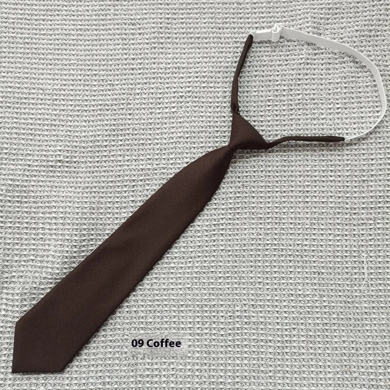Navy blue cotton bow tie with arrow style design showing 35cm length