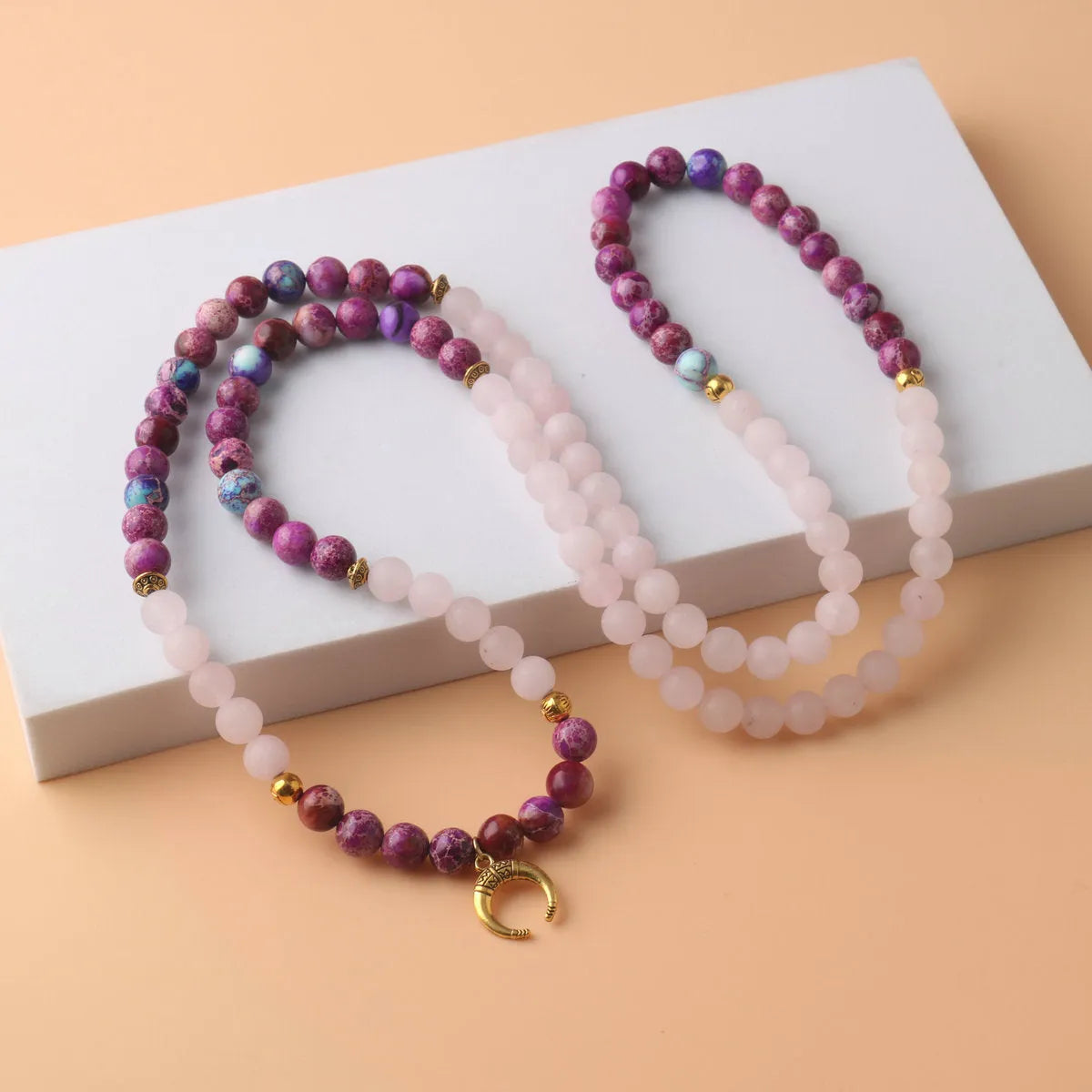 Round pendant necklace with pink crystal emperor stone and personalised bead design on chain