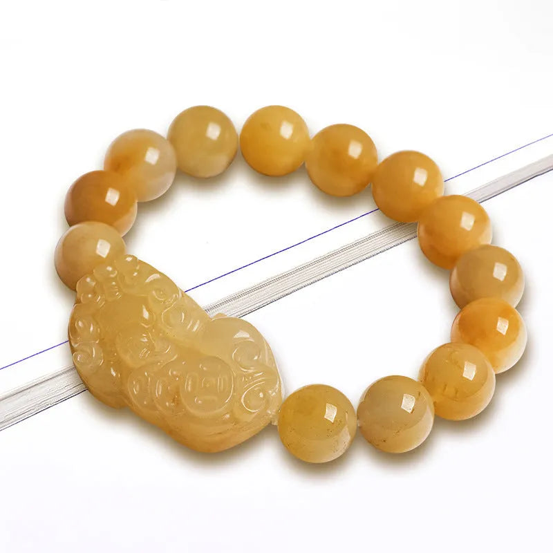 Hand-carved golden thread jade money coin bracelet with jade beads in two size options.