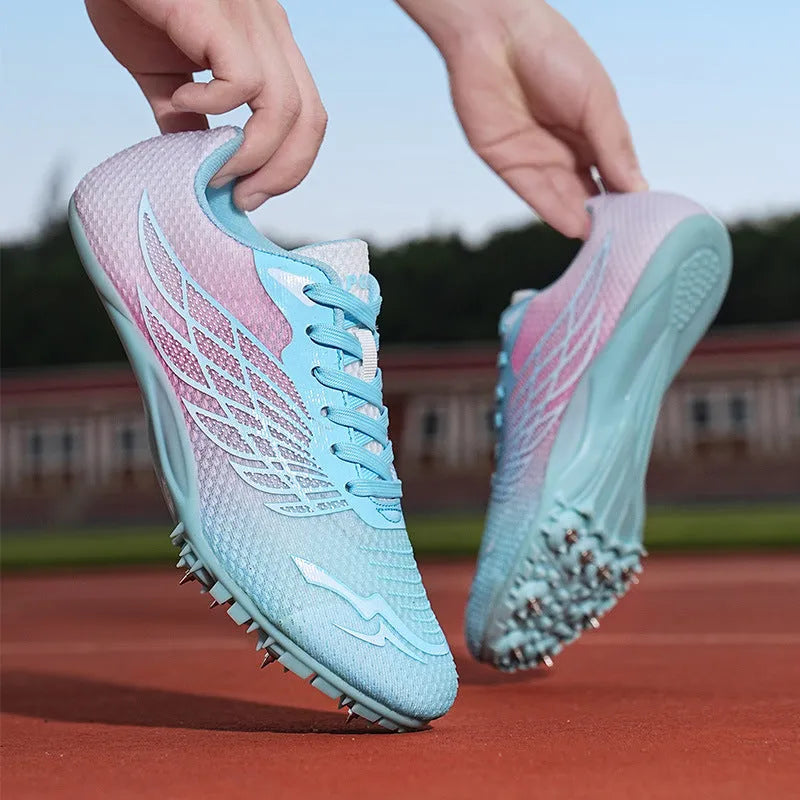 Track and field spiked shoes in White Royal Blue and White Light Blue with mesh upper, PVC sole, and front tie up fastening, sizes 36 to 45