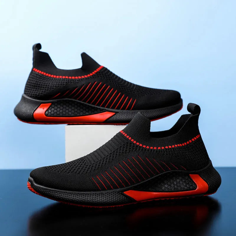 Men's black and white striped mesh slip-on sneakers with lace-up front on a white background