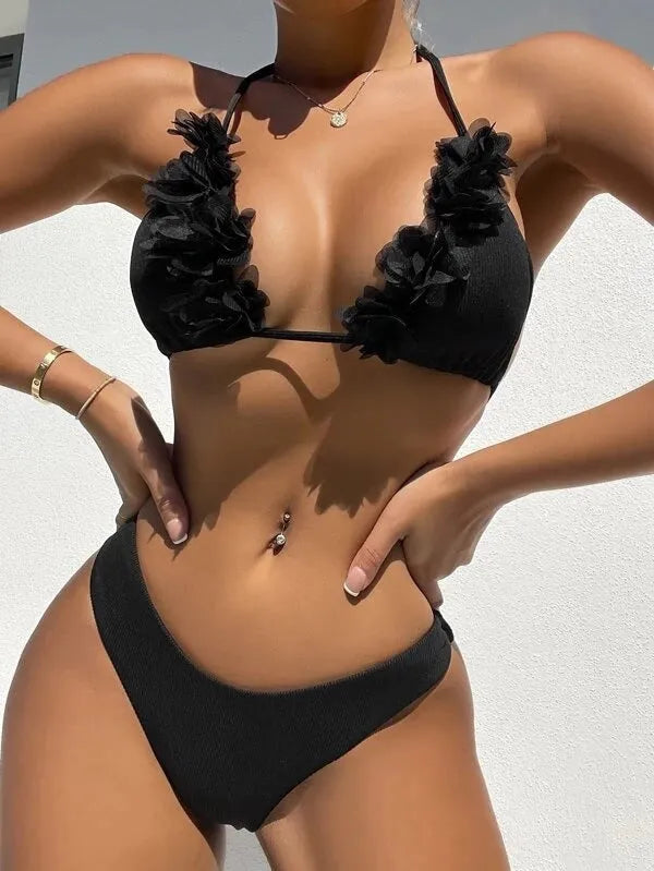 Black gathered design women's swimwear set with bikini top and shorts on mannequin