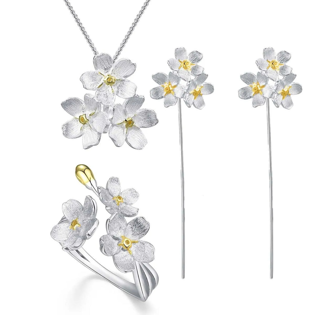 Hand-designed sterling silver Myosotis flower pendant in pastoral style, showing gold and silver colour options.