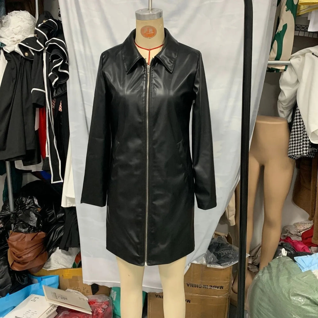 Black women's medium length leather jacket on a hanger