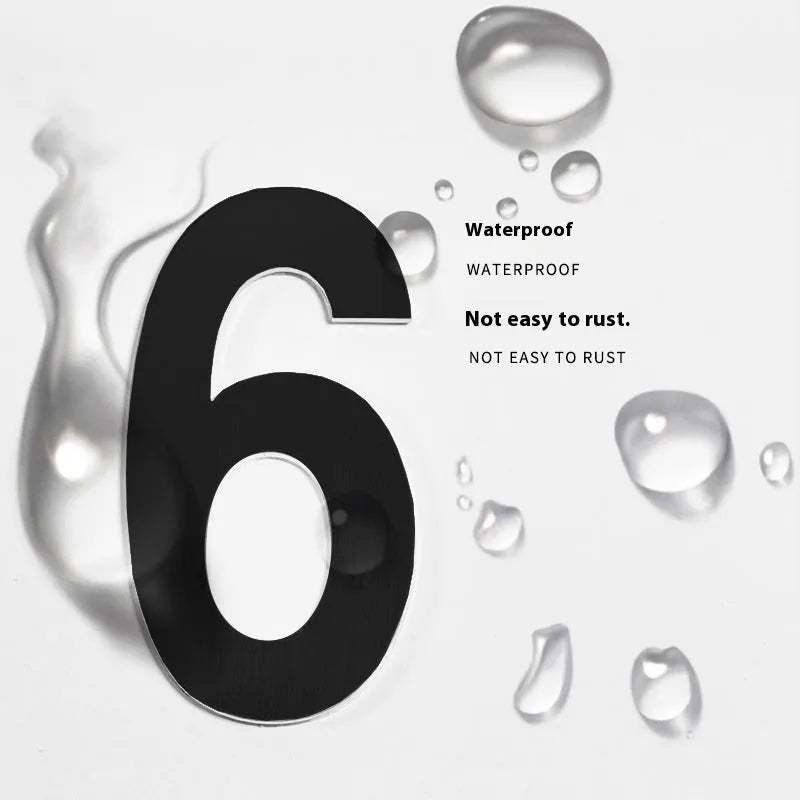 Black stainless steel adhesive house numbers and letters, each 7.5cm tall, for property identification.