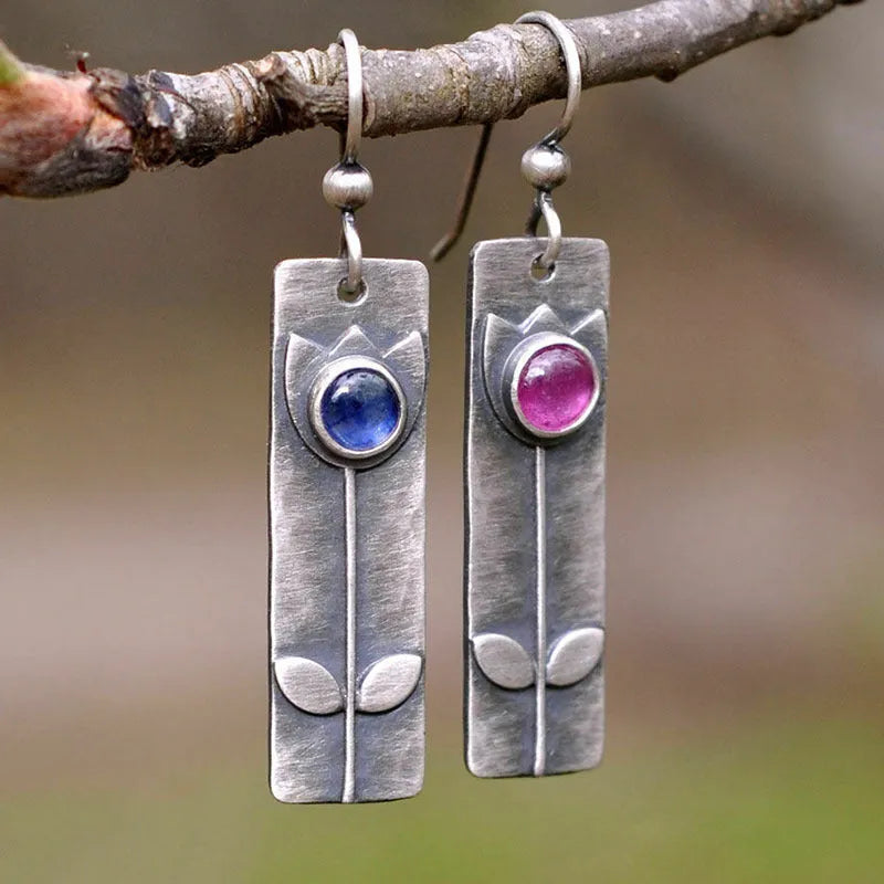 Antique finish geometric earrings with red sapphire ellipse details on electroplated metal