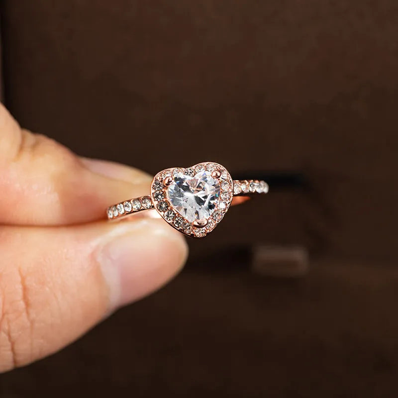 Heart-shaped crystal wedding ring with electroplated rose gold or silver finish on white copper