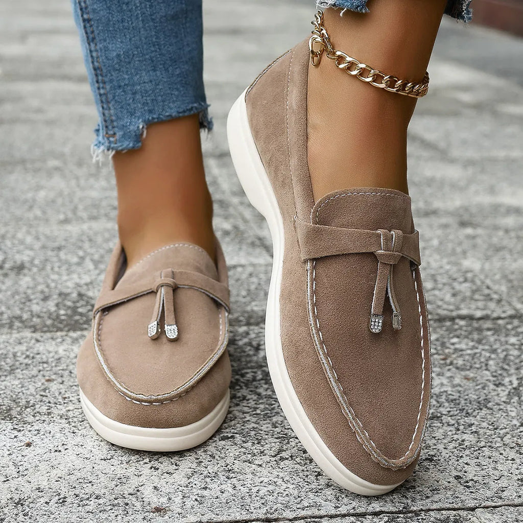 Casual apricot coloured canvas slip-on loafers with a round toe and platform heel.