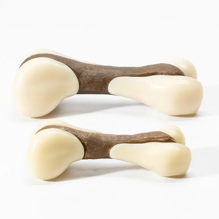 Bone-shaped dog chew toy with cowhide exterior and nylon core in two size options