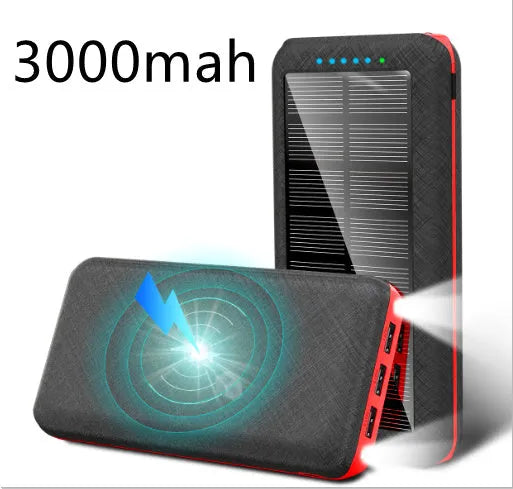 Black portable power bank with wireless Qi charging pad, three USB ports, and LED flashlight