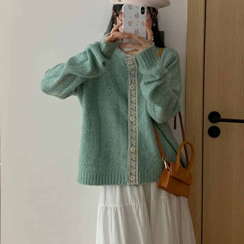 Women's loose artistic retro cardigan sweater coat in light grey viscose fibre, shown open as a layering piece.