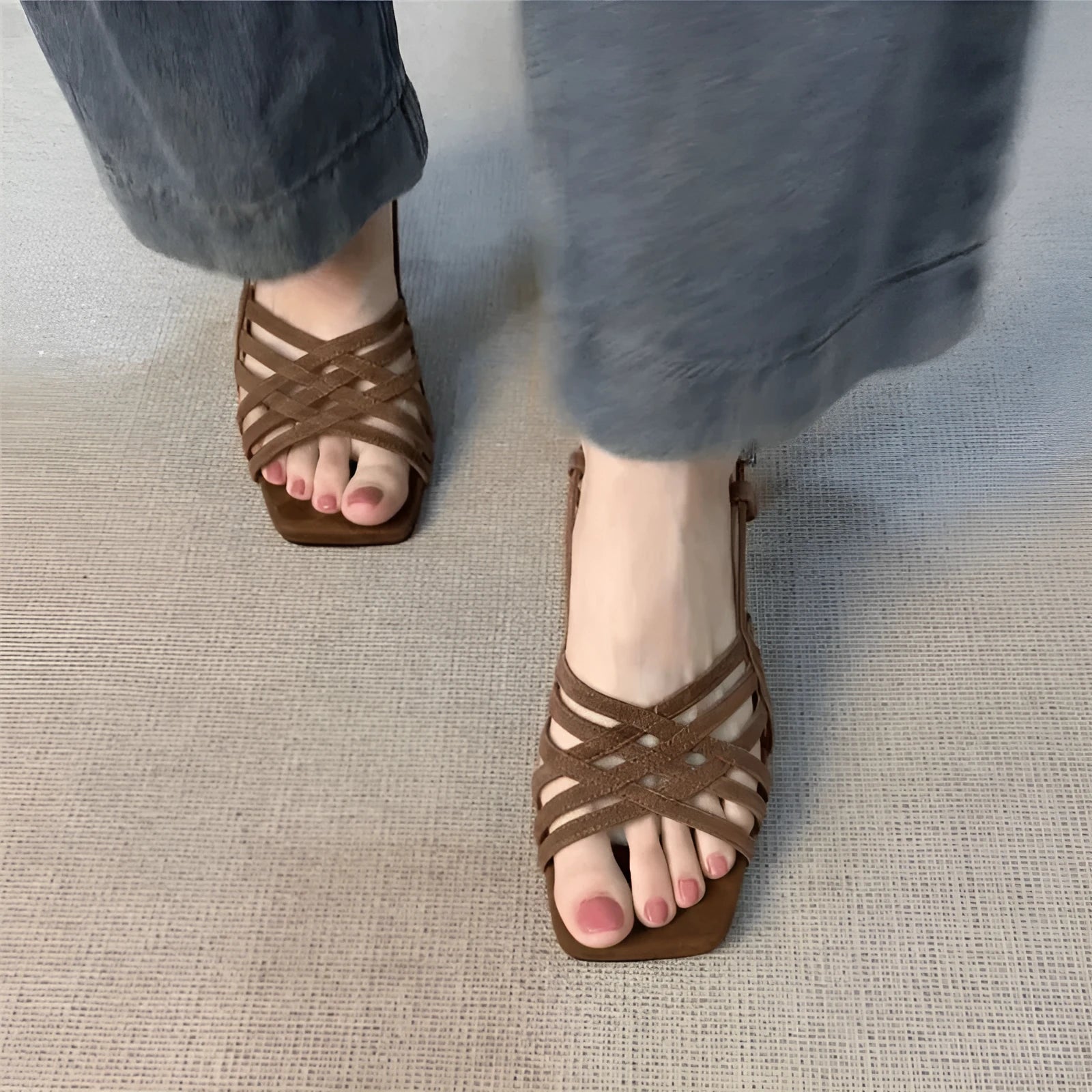 Retro beige high heel sandals with thin cross straps and an ankle buckle on a square toe.