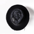 Handmade wool felt conical hat with skull design and denim-style crown