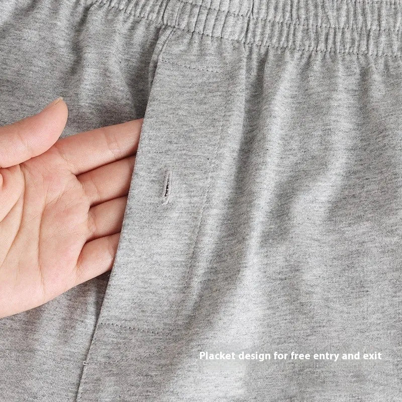Men's solid colour cotton boxer shorts with a high waist and loose fit on a neutral background.