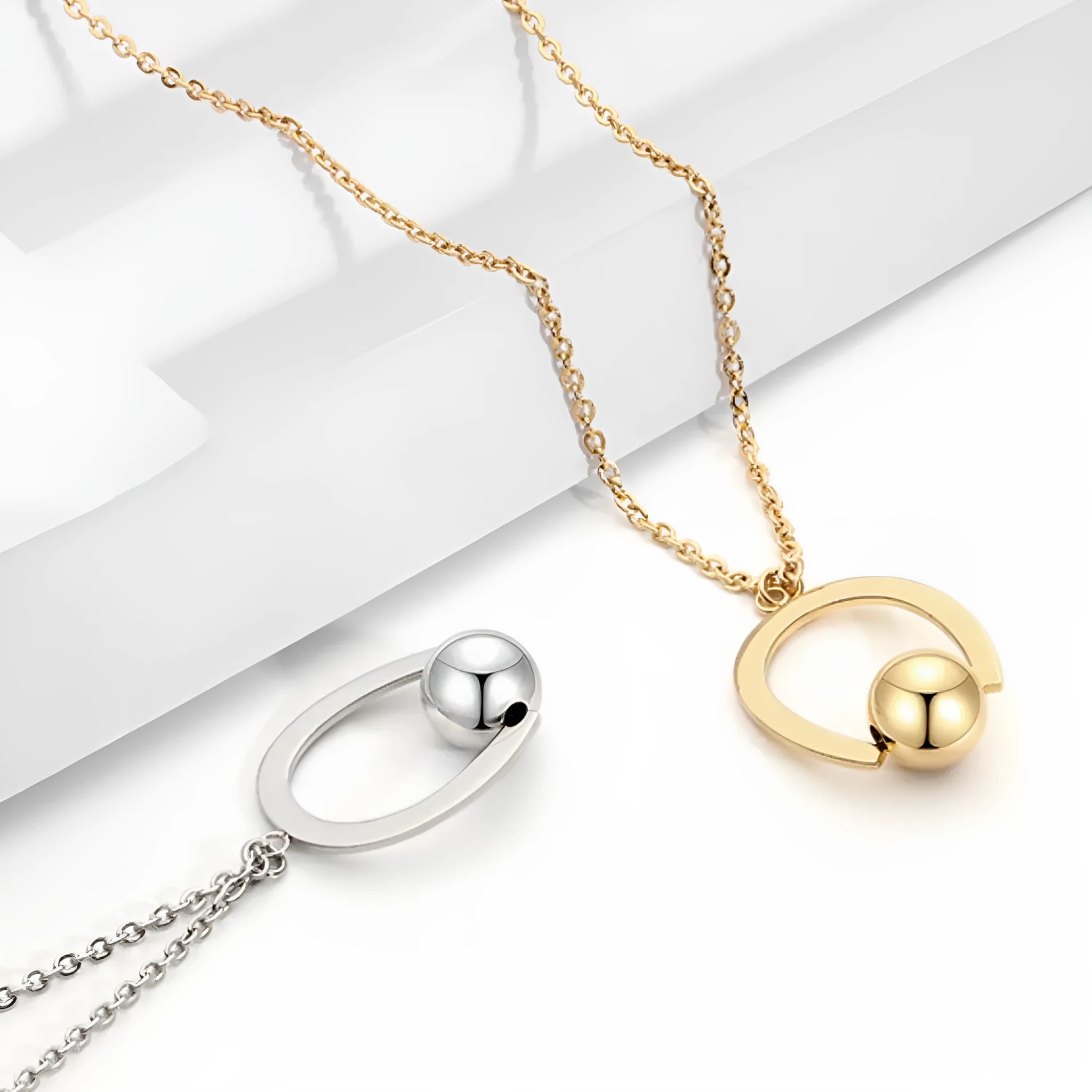 Stainless steel bead chain necklace with geometric pendant in gold or silver finish, adjustable 21-50cm length.