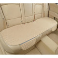 Linen plaid car seat cushion with hemmed edges in charm coffee colour on a car seat.